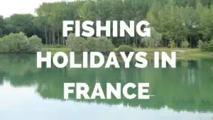 Fishing holidays in France text overlay on tranquil lake scene, emphasizing van hire for convenient fishing trips.